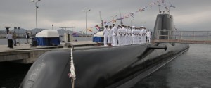 Greek Navy officers of Pipinos submarine stand during a launch ceremony at Skaramanga shipyards near Athens, on Monday, Oct. 6, 2014. Greece launched the submarine Pipinos Monday, the first of three German-designed Type 214 submarines featuring an air-independent propulsion system. Its construction followed years of delays due to legal and technical disputes. (AP Photo/Petros Giannakouris)