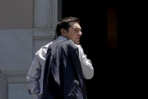 Greek Prime Minister Alexis Tsipras looks on as he arrives at this office at Maximos Mansion in Athens June 20, 2015. Greece will try to bring more to the table in negotiations for a debt deal and Tsipras will probably speak with European Commission chief Jean-Claude Juncker by phone on Saturday to try to end the deadlock, a Greek minister said. REUTERS/Alkis Konstantinidis