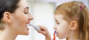 mother-and-daughter-brushing-teeth-708