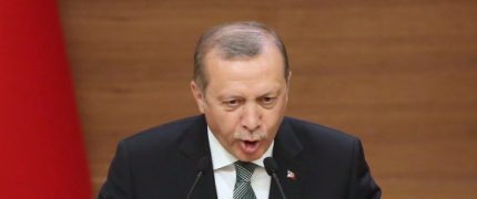 Turkish President Tayyip Erdogan gestures as he speaks during a meeting with mukhtars or local  village and town leaders at the Presidential Palace in Ankara, on May 4, 2016.   / AFP / ADEM ALTAN        (Photo credit should read ADEM ALTAN/AFP/Getty Images)